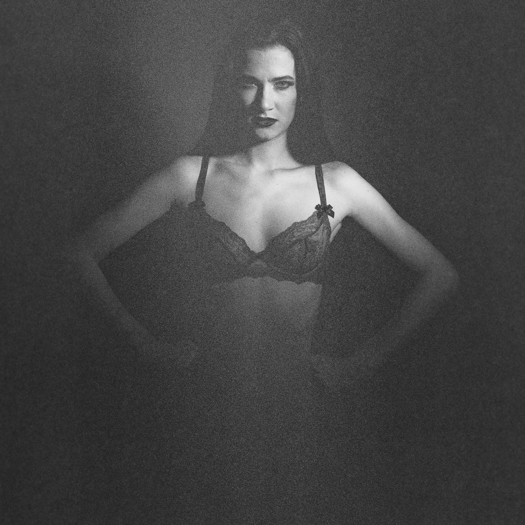 Lauren in the Studio II 
Another picture from my recent try out of my 500 C/M in the studio with a fresnel spot/flash. As the film, an Ektar 800, was 12 years over it's date, I was wondering how the results would look. I did not much like the color thus I did a colored bw version. Scanned with a Nikon Coolscan 9000 you can literally see each corn of grain in the original sized picture. Btw. the strong shadow is on purpose as I try to start a series with a fresnel light and the lighting of the portrait pictures of the 30ies/40ies of the last century... 

http://www.b2s.pm/J0FZad